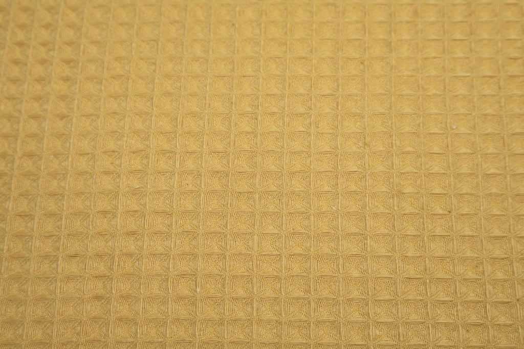 Tissu nid d'abeille moutarde